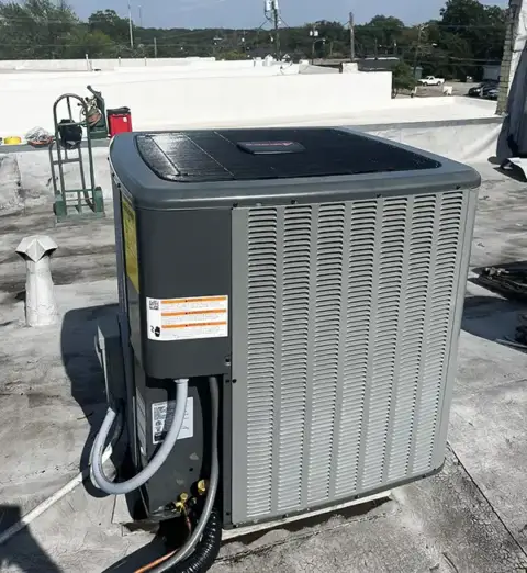 HVAC unit installed on rooftop by Matthew's Heating & Air.